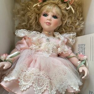 Elegant Pink Porcelain Doll